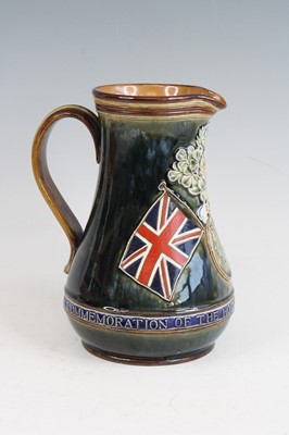 Lot 2059 - A Doulton Lambeth stoneware jug, on a mottled...