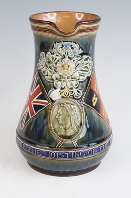 Lot 2059 - A Doulton Lambeth stoneware jug, on a mottled...