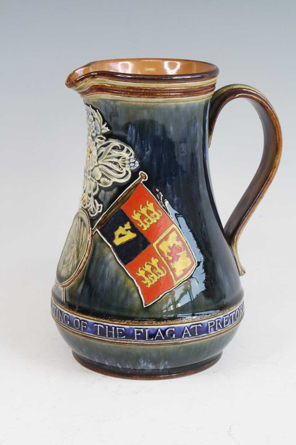 Lot 2059 - A Doulton Lambeth stoneware jug, on a mottled...