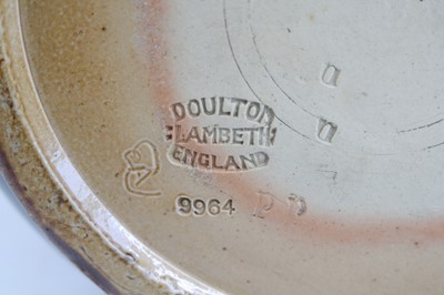 Lot 2059 - A Doulton Lambeth stoneware jug, on a mottled...