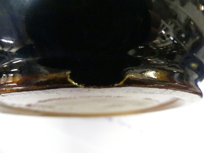 Lot 2059 - A Doulton Lambeth stoneware jug, on a mottled...