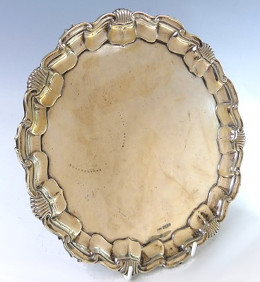Lot 2173 - An Edwardian silver salver, of shaped circular...