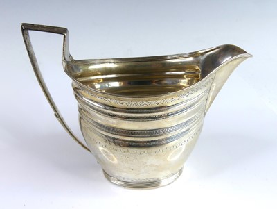 Lot 2120 - A George III silver milk jug, of oval form...