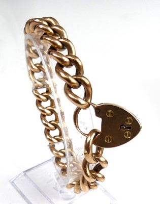 Lot 2299 - A rose metal hollow rounded curblink bracelet,...