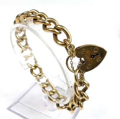 Lot 2337 - A 9ct yellow gold rounded curblink bracelet,...
