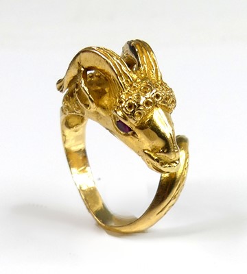 Lot 2268 - A yellow metal ring in the form of a horned...