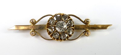 Lot 2235 - A yellow metal diamond bar brooch, comprising...