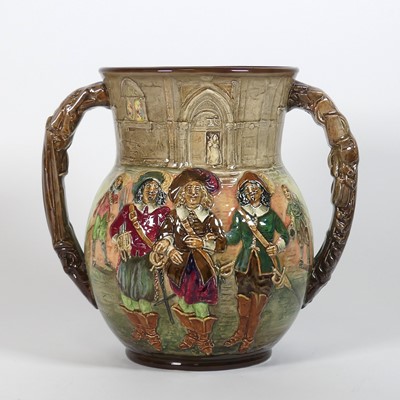 Lot 23 - A Royal Doulton Three Musketeers twin handled...