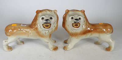 Lot 123 - A pair of Staffordshire pottery lions,...