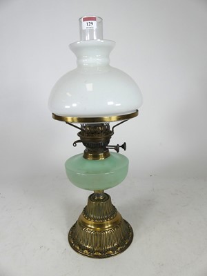 Lot 129 - An early 20th century oil lamp, having an...