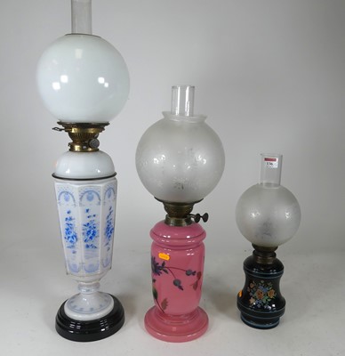 Lot 136 - A 19th century oil lamp, having an opaline...