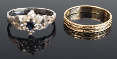 Lot 307 - A 9ct gold engraved wedding band, size I, 1.1g;...