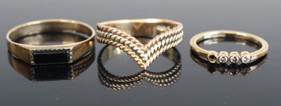 Lot 311 - A 9ct gold diamond four-stone half-hoop ring...