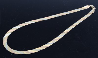 Lot 324 - A modern 9ct three-colour gold flatlink...