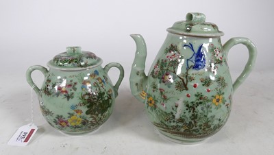 Lot 193 - A Japanese celadon glazed enamel & relief...