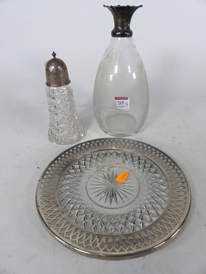 Lot 215 - A cut glass sugar caster having a pierced...