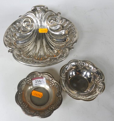 Lot 216 - A white metal repoussee decorated shell shaped...