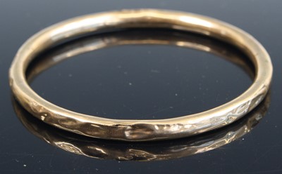 Lot 338 - A 9ct gold hollow bangle, 8.5cm, 10.9g (a/f)