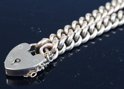 Lot 339 - A 9ct gold curblink bracelet, having heart...