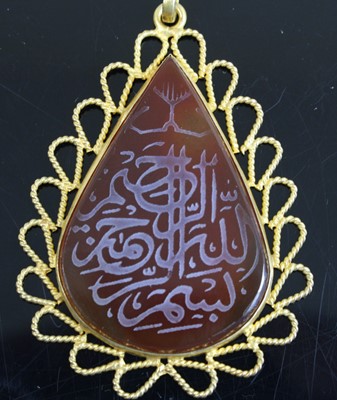 Lot 344 - A Middle-Eastern yellow metal and agate set...