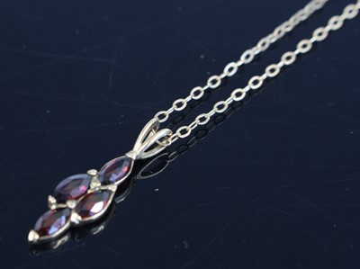 Lot 348 - A 9ct gold garnet set lozenge pendant, h.24mm,...