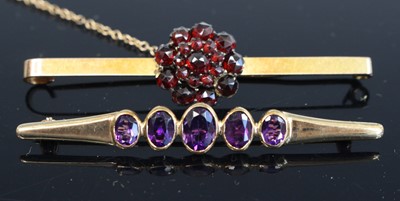 Lot 355 - A 9ct gold garnet set bar brooch, with steel...