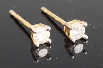 Lot 370 - A pair of modern 9ct gold diamond ear studs,...
