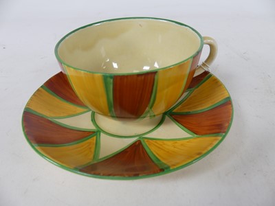 Lot 223 - A Clarice Cliff Globe pattern cup and saucer,...