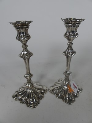 Lot 229 - A pair of Old Sheffield plate candlesticks, in...