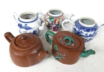 Lot 236 - A collection of Chinese teapots, to include...