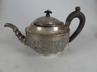 Lot 275 - A white metal teapot, of squat circular form,...
