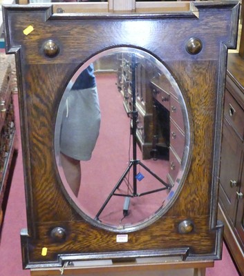 Lot 1012 - An oak framed and bevelled wall mirror, early...