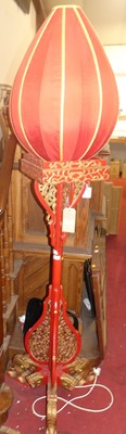 Lot 1137 - An Oriental red painted and gilt decorated...