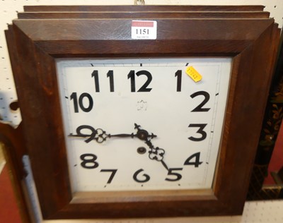 Lot 1151 - An Art Deco oak square wall clock