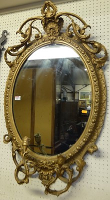 Lot 1152 - A 19th century and later gilded oval wall...