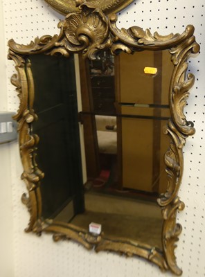 Lot 1164 - A floral gilt composite framed wall mirror in...