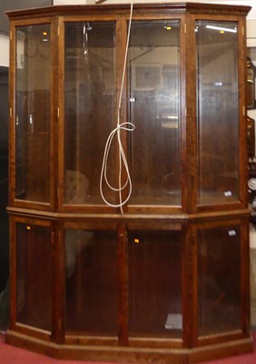 Lot 1166 - A contemporary freestanding two-tier display...