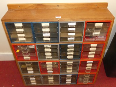 Lot 1180 - A wall mounted parts storage cabinet, fitted...