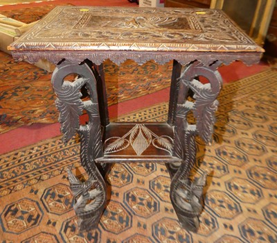 Lot 1187 - An Indian relief carved hardwood two-tier...