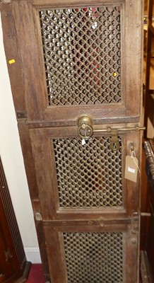 Lot 1193 - A pair of Indonesian hardwood, iron and brass...
