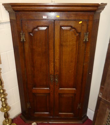 Lot 1195 - A George III provincial oak double door...