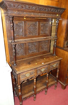 Lot 1203 - A relief carved oak small dresser, h.180cm,...