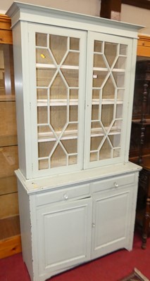 Lot 1204 - An Edwardian walnut and later painted library...