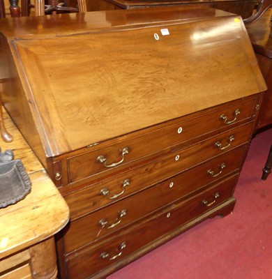 Lot 1229 - A George III mahogany slopefront fitted...