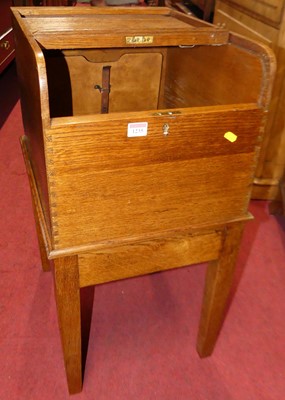 Lot 1235 - A mid-20th century oak tambour topped office...