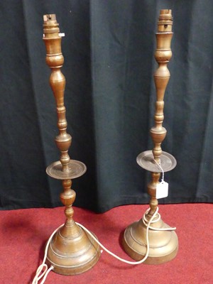 Lot 449 - A pair of brass table lamps, in the 17th...