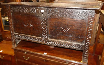 Lot 1265 - An 18th century oak two panelled hinge topped...
