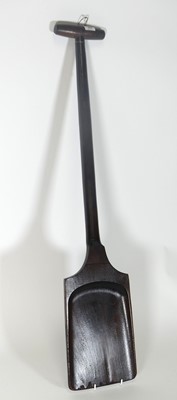 Lot 450 - A reproduction stained beech malt shovel,...