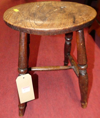Lot 1273 - A 19th century provincial elm milking stool, h....