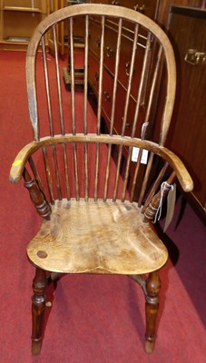 Lot 1274 - An elm and fruitwood child's comb-back Windsor...